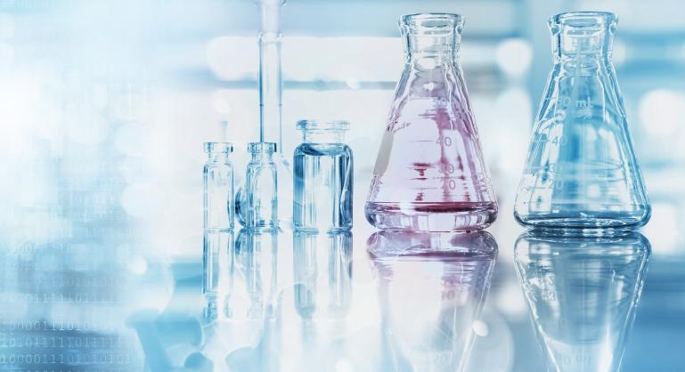 soft focus flask and beaker on lab bench